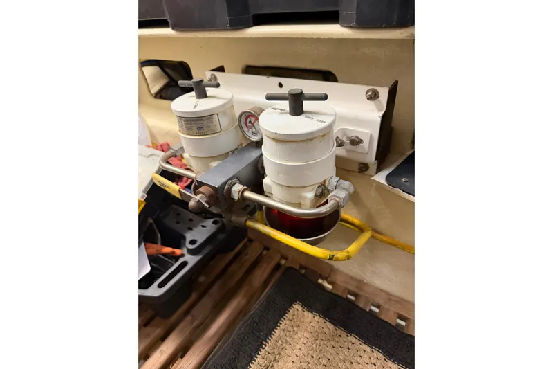Slide: The Image of Fuel filter system on a 2010 DeFever 48 Trawler, featuring dual filters and pressure gauge. - 31