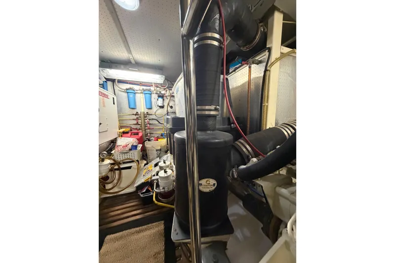 Slide: The Image of Engine room of 2010 DeFever 48 Trawler with visible equipment and piping. - 32