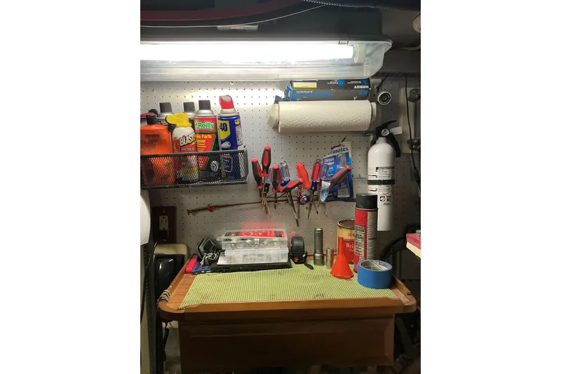 Slide: The Image of Workshop area on a 2010 DeFever 48 Trawler with tools and supplies neatly organized. - 33