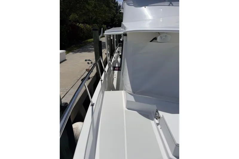 Slide: The Image of Side deck of 2010 DeFever 48 Trawler docked. - 38