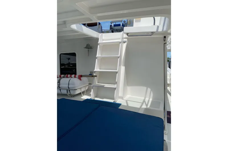 Slide: The Image of 2010 DeFever 48 Trawler interior with ladder and seating area. - 42