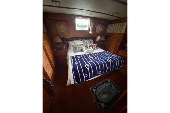 Slide: The Image of DeFever 48 Trawler 2010 helm with steering wheel and cushion. - 5