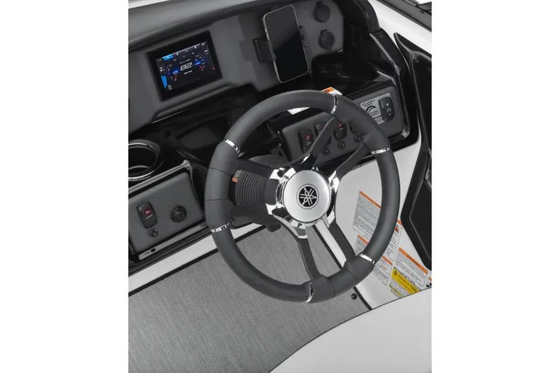 Slide: The Image of Manufacturer Provided Image: 2026 Yamaha Boats AR195 steering wheel and dashboard with modern controls. - 8