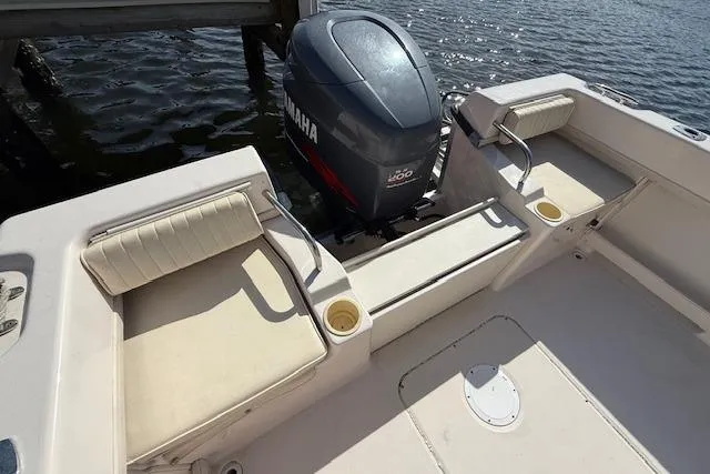 Slide: The Image of Grady-White Seafarer 22 boat, 2000 model, with Yamaha outboard motor, docked on water. - 11