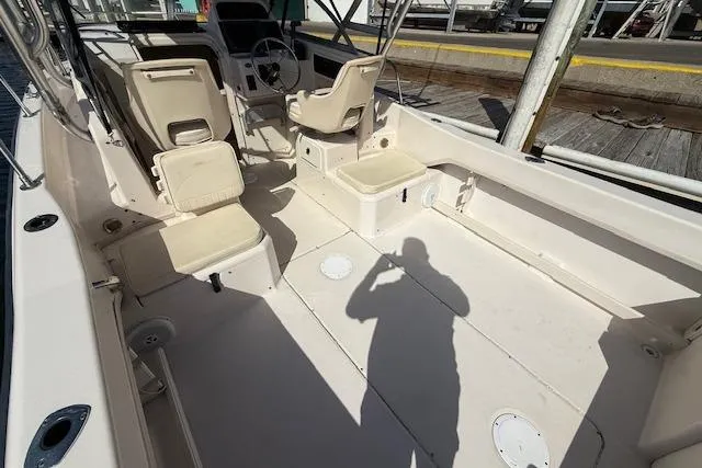 Slide: The Image of 2000 Grady-White Seafarer 22 boat interior with seating and steering console. - 14