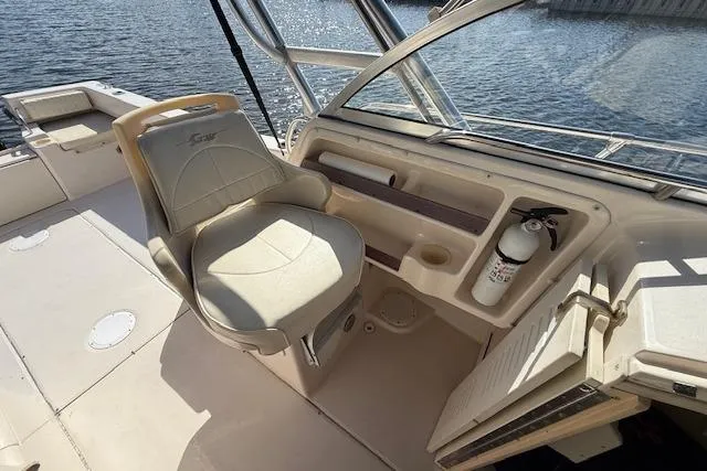 Slide: The Image of 2000 Grady-White Seafarer 22 boat interior with captain's chair and dashboard. - 15