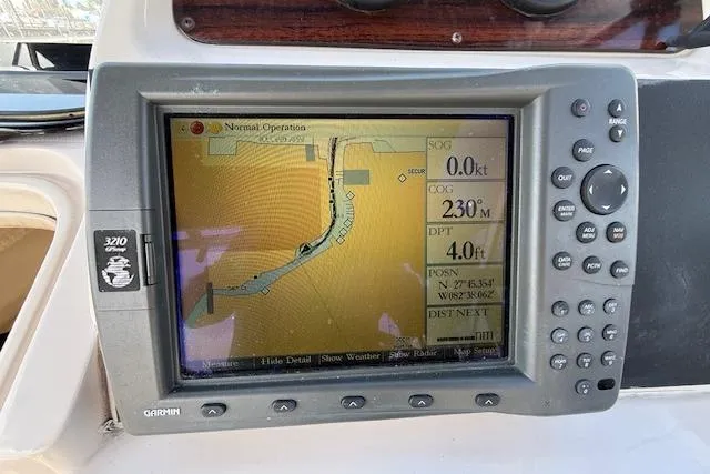Slide: The Image of Garmin GPS display on 2000 Grady-White Seafarer 22 boat, showing navigation map and coordinates. - 19