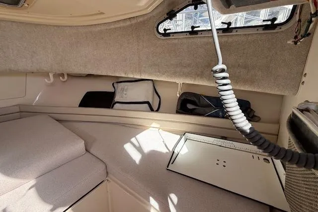 Slide: The Image of Interior cabin of 2000 Grady-White Seafarer 22 boat, featuring seating and storage. - 23