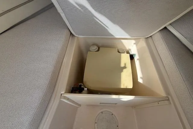 Slide: The Image of Storage compartment in a 2000 Grady-White Seafarer 22 boat interior. - 24