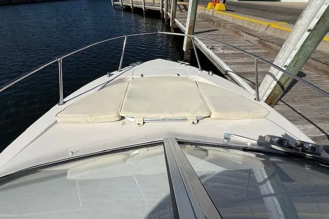 Slide: The Image of 2000 Grady-White Seafarer 22 boat docked, showing bow with cushioned seating. - 26