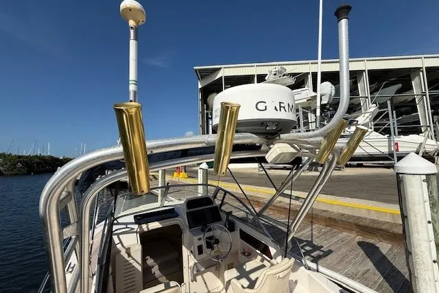 Slide: The Image of Grady-White Seafarer 22 boat, 2000 model, docked with radar and fishing rod holders. - 27