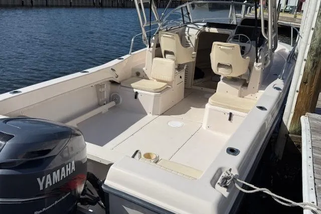 Slide: The Image of 2000 Grady-White Seafarer 22 boat with Yamaha engine docked by the water. - 29