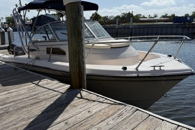 Slide: The Image of 2000 Grady-White Seafarer 22 boat docked at a marina. - 7