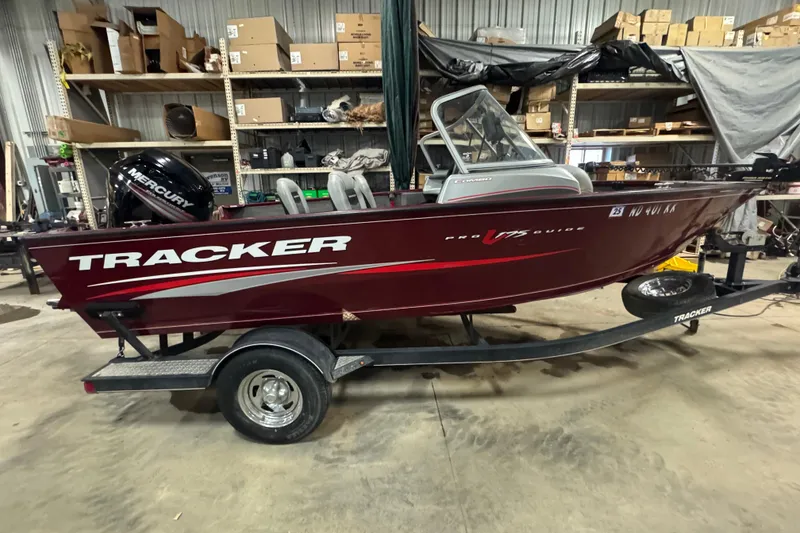 The Image of 2017 Tracker Pro Guide V-175 Combo boat in a warehouse, on a trailer. - 0