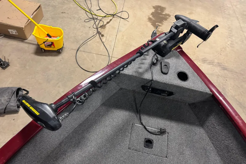 Slide: The Image of 2017 Tracker Pro Guide V-175 Combo boat with Minn Kota trolling motor in garage. - 11