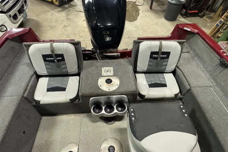 Slide: The Image of 2017 Tracker Pro Guide V-175 Combo boat interior with seating and motor. - 8