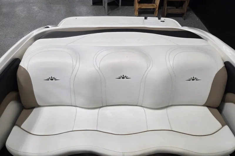 Slide: The Image of White leather boat seating in a 2007 Mariah SX19, featuring elegant stitching and design. - 10