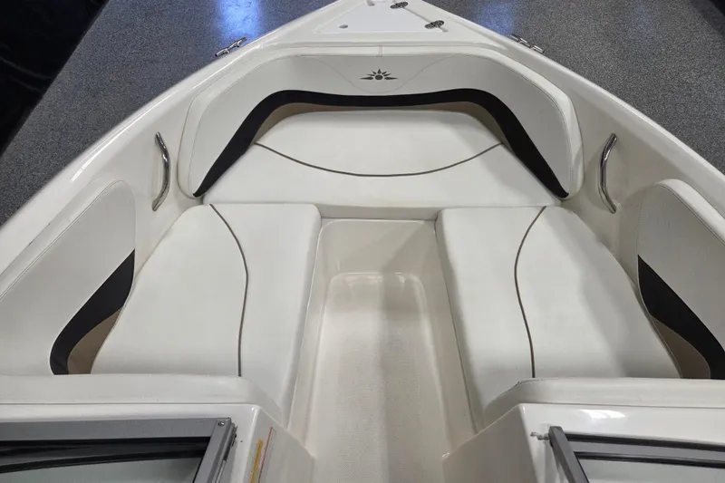 Slide: The Image of 2007 Mariah SX19 boat interior with white cushioned seating and sleek design. - 6