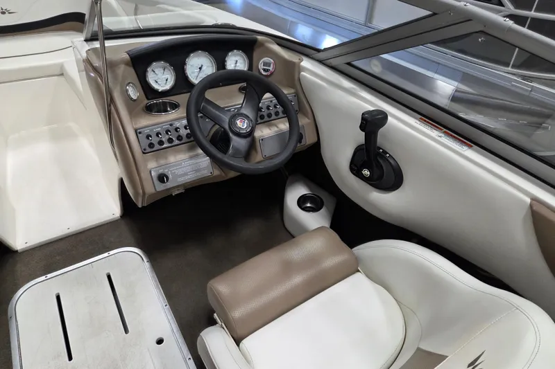 Slide: The Image of 2007 Mariah SX19 boat cockpit with steering wheel and control panel. - 8