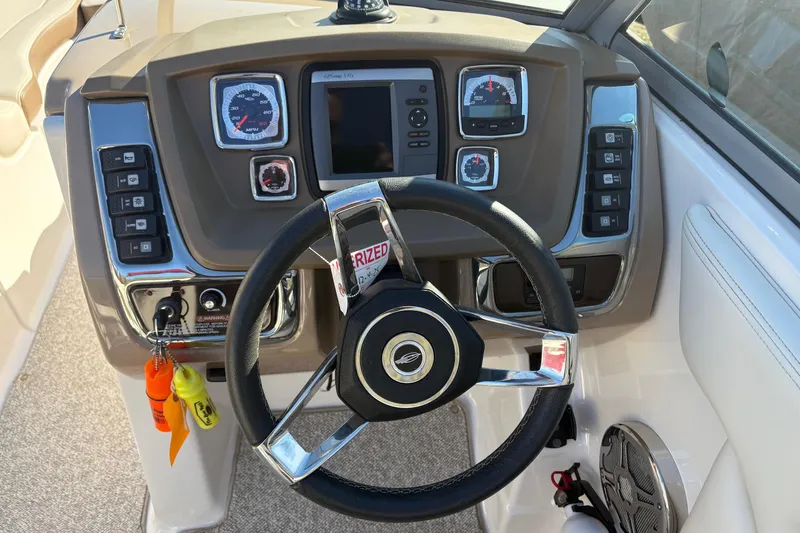 Slide: The Image of Steering console of 2013 Chaparral 244 Sunesta boat with gauges and controls. - 7