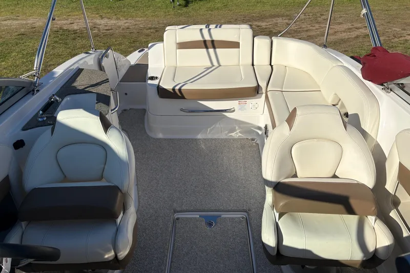 Slide: The Image of Interior of a 2013 Chaparral 244 Sunesta boat with white and brown seating. - 8