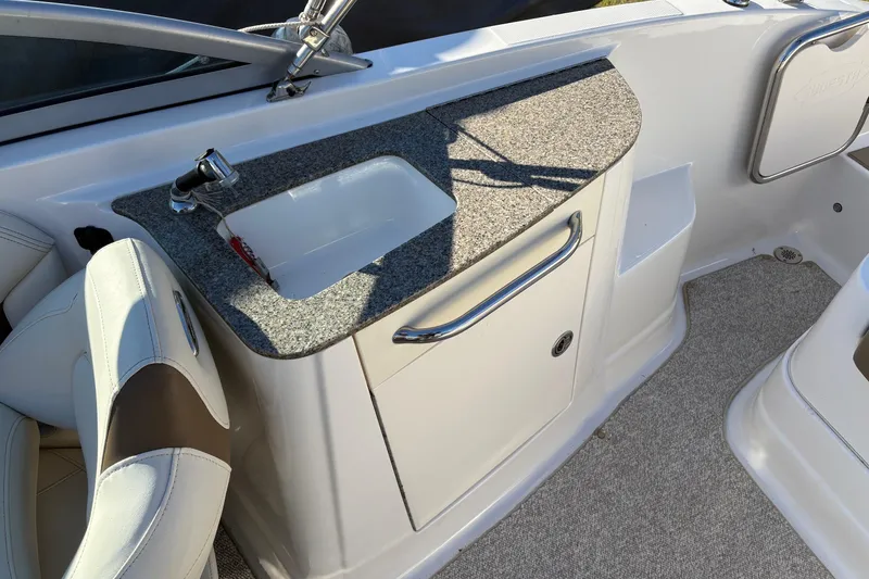 Slide: The Image of 2013 Chaparral 244 Sunesta boat interior with sink and countertop. - 9