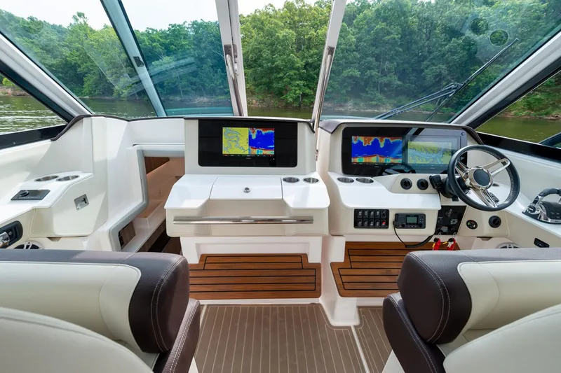 Slide: The Image of Manufacturer Provided Image: Interior of 2026 Regal LX36 boat with modern dashboard and navigation screens. - 6