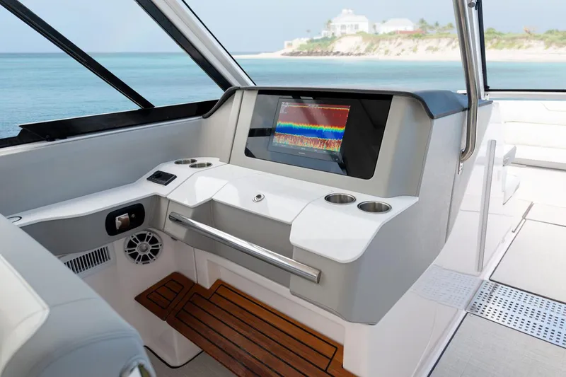Slide: The Image of Manufacturer Provided Image: 2026 Regal LX36 boat dashboard with modern controls and ocean view. - 8