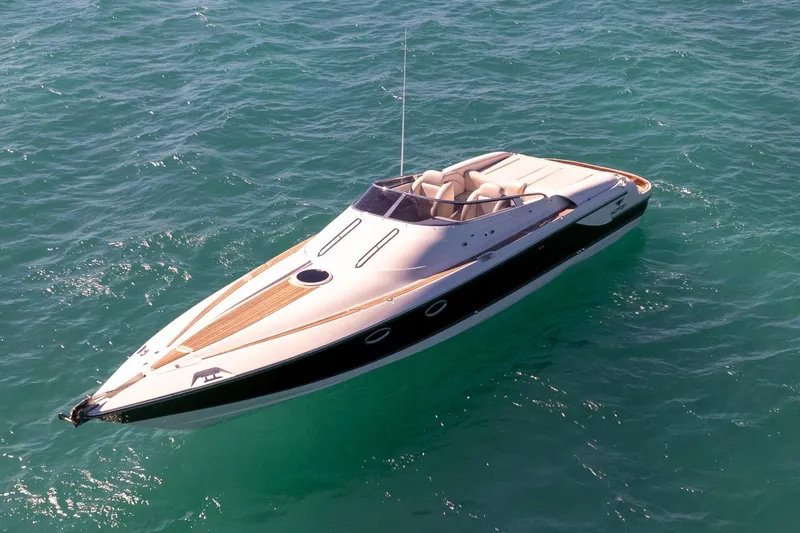 The Image of 2012 Hunton XRS 37 luxury speedboat on clear blue water. - 0
