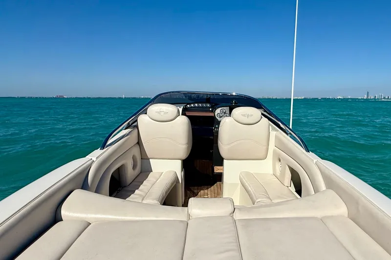 Slide: The Image of Luxury 2012 Hunton XRS 37 boat interior with cream leather seats on open water. - 10