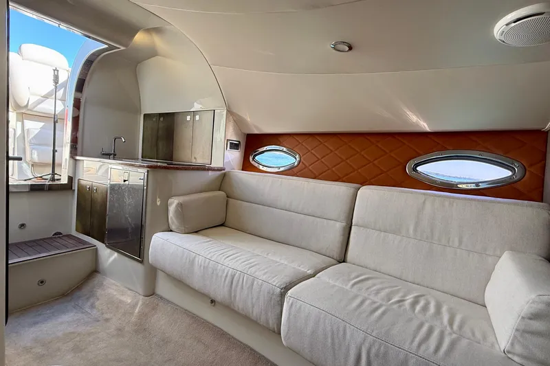 Slide: The Image of Luxurious interior of 2012 Hunton XRS 37 yacht with plush seating and kitchenette. - 12