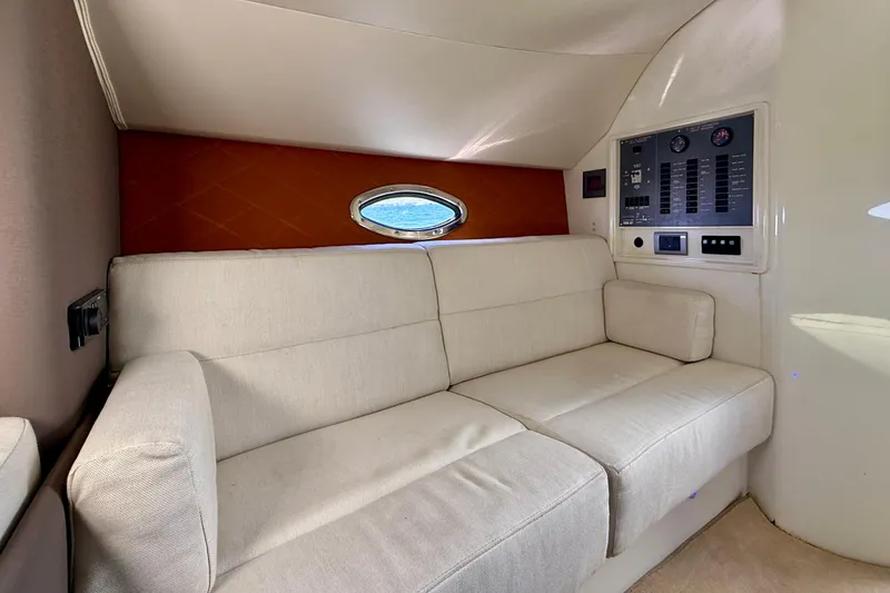Slide: The Image of Interior of 2012 Hunton XRS 37 yacht with beige sofa and control panel. - 13
