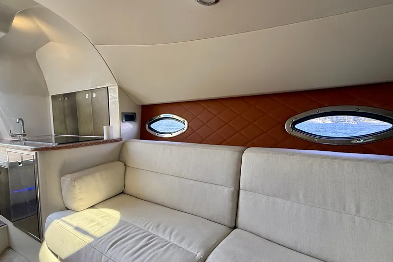 Slide: The Image of Luxurious interior of 2012 Hunton XRS 37 yacht with plush seating and kitchenette. - 17