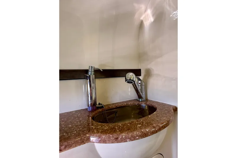 Slide: The Image of Luxurious bathroom sink in 2012 Hunton XRS 37 yacht with elegant fixtures. - 20