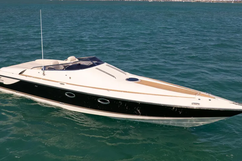 Slide: The Image of 2012 Hunton XRS 37 luxury speedboat cruising on open water. - 4