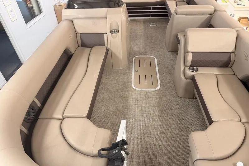 Slide: The Image of Interior of a 2021 Bennington 23 LSB SPS pontoon boat with beige seating. - 2