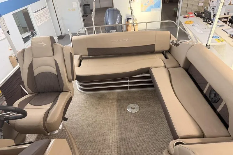 Slide: The Image of Interior of a 2021 Bennington 23 LSB SPS pontoon boat with beige seating. - 3