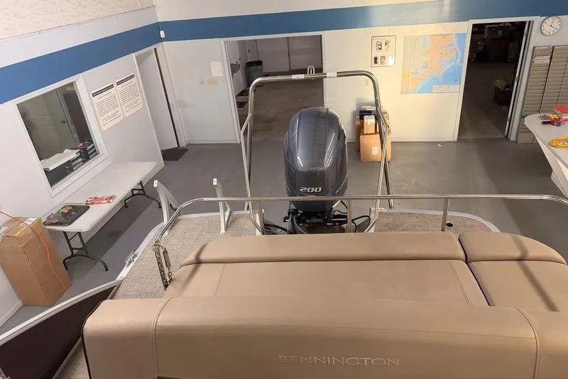 Slide: The Image of 2021 Bennington 23 LSB SPS boat with 200 HP engine in a showroom. - 4