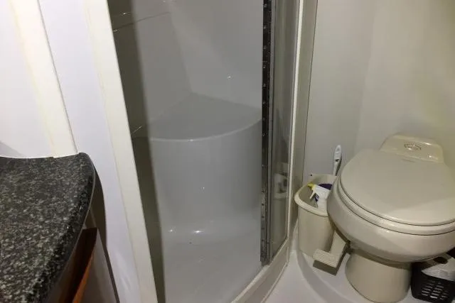 Slide: The Image of Bathroom in 2004 Carver 420 Mariner yacht with shower and toilet. - 12