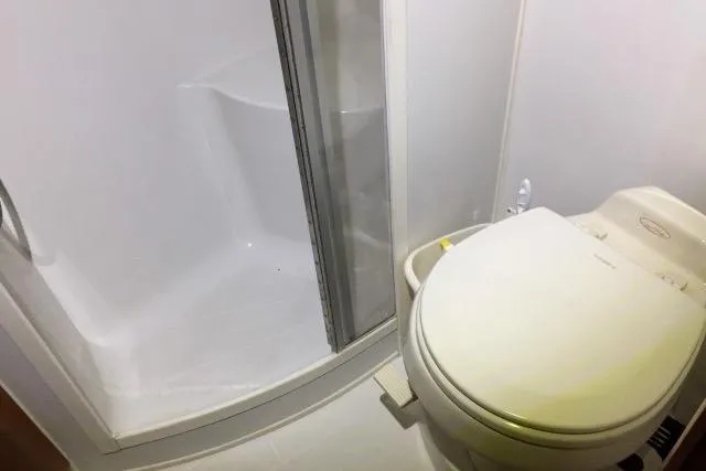 Slide: The Image of Bathroom in 2004 Carver 420 Mariner yacht with shower and toilet. - 13