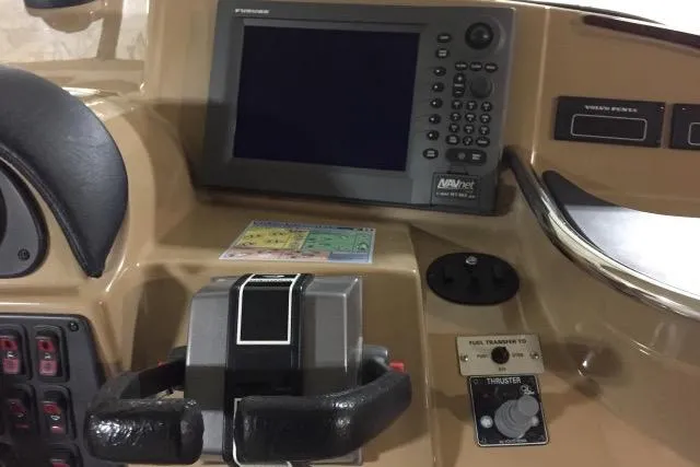 Slide: The Image of Control panel of a 2004 Carver 420 Mariner boat with navigation system. - 16