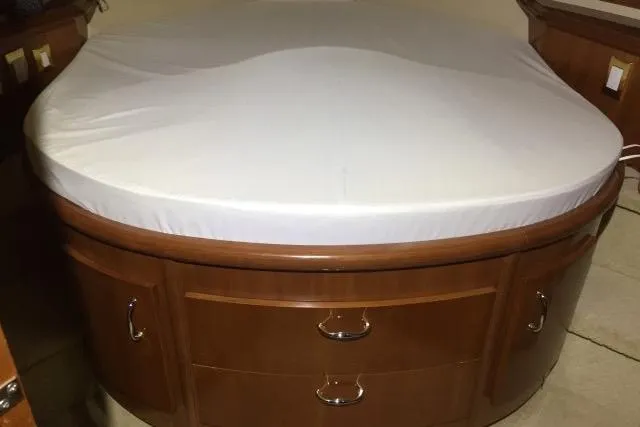 Slide: The Image of Round bed with wooden storage drawers in a 2004 Carver 420 Mariner yacht. - 9