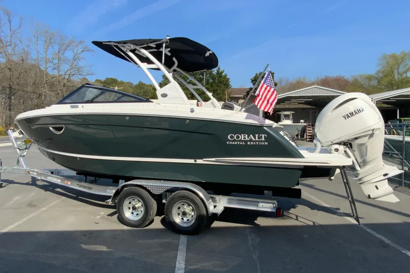 Slide: The Image of 2026 Cobalt R6 Outboard boat on trailer, featuring Yamaha engine and American flag. - 15