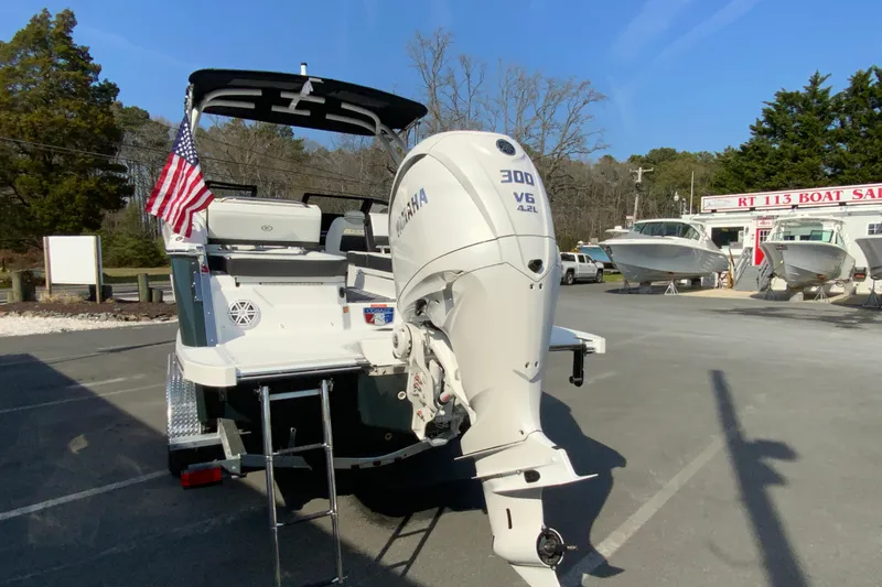 Slide: The Image of 2026 Cobalt R6 Outboard boat with Yamaha 300 V6 engine at dealership. - 19