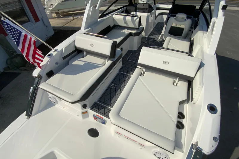 Slide: The Image of 2026 Cobalt R6 Outboard boat interior with luxurious seating and American flag. - 25