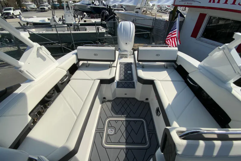Slide: The Image of 2026 Cobalt R6 Outboard boat interior with white seating and modern design. - 26