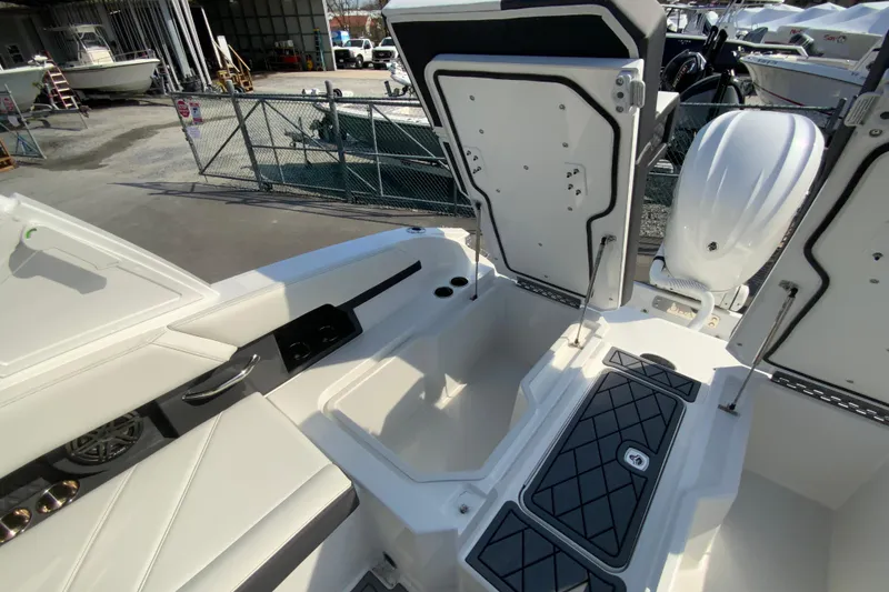 Slide: The Image of 2026 Cobalt R6 Outboard boat interior with open storage compartments and sleek design. - 30