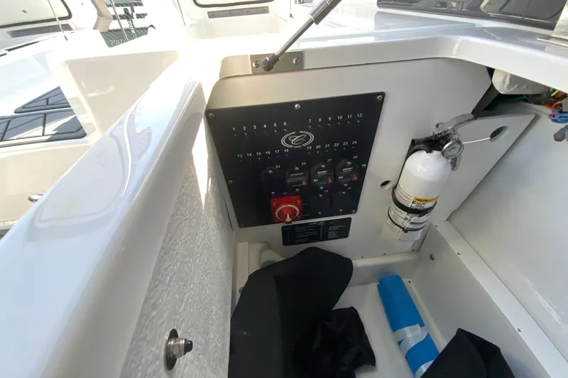 Slide: The Image of Control panel and fire extinguisher on 2026 Cobalt R6 Outboard boat. - 33