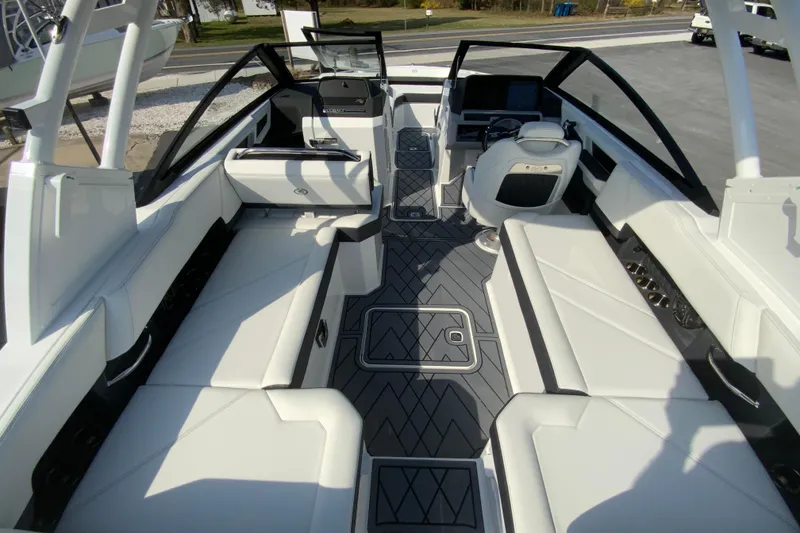 Slide: The Image of 2026 Cobalt R6 Outboard boat interior with sleek white seating and modern design. - 35