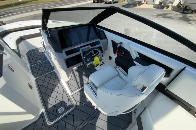 Slide: The Image of 2026 Cobalt R6 Outboard boat cockpit with modern controls and luxurious seating. - 36